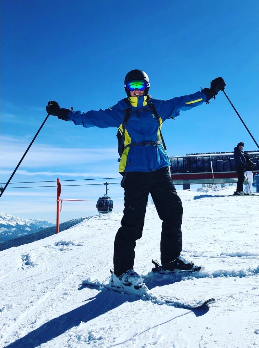 PGL Ski Instructor cheering on a mountain