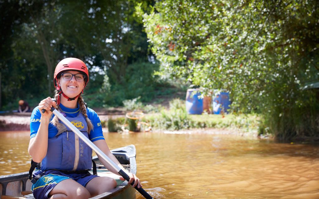 A Paddle Sports Instructor in a canoe on the lake at Boreatton Park