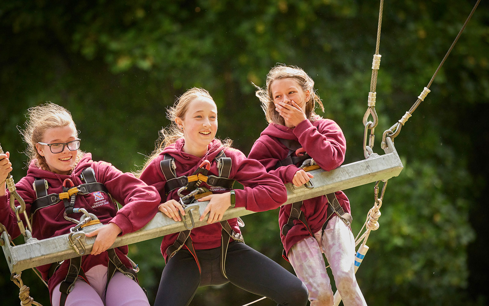 Three girls on the Giant Swing at PGL
