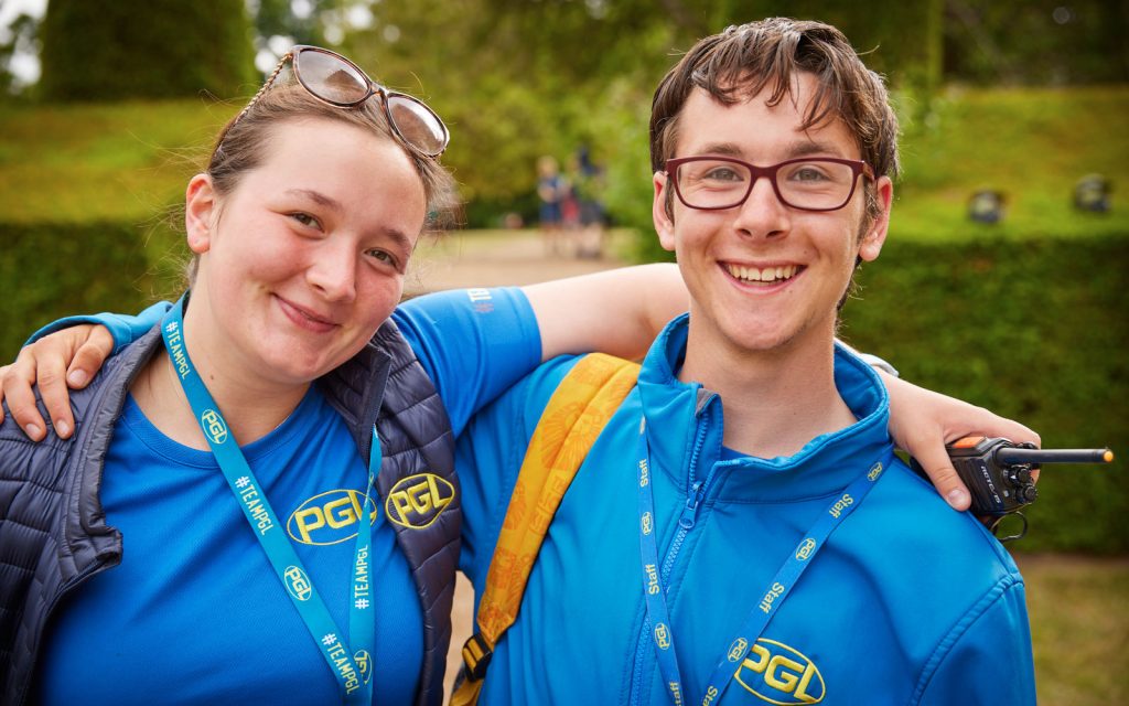 Two smiling PGL employees at Ford Castle
