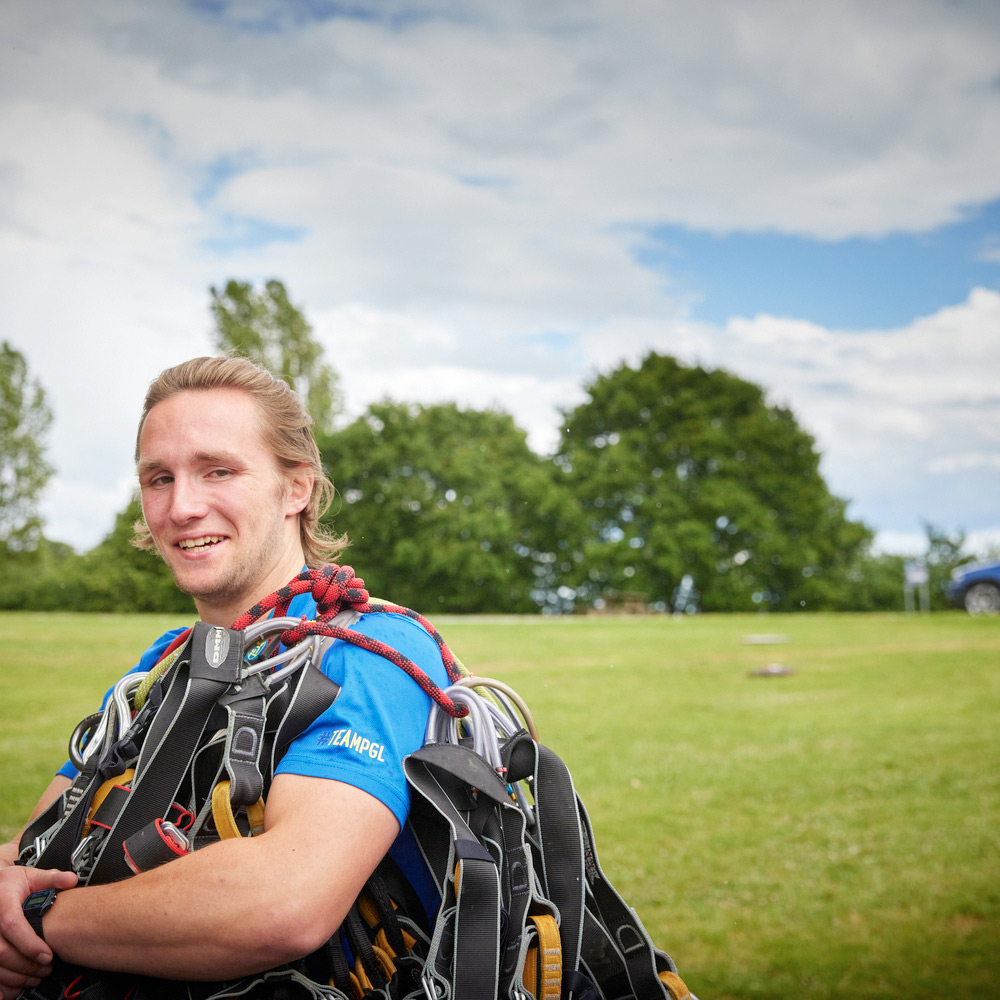 PGL colleague holding climbing equipment